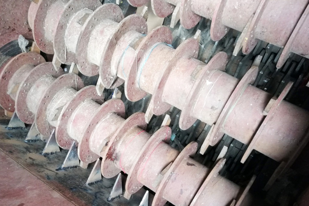 grapple hooks inside debaler machine