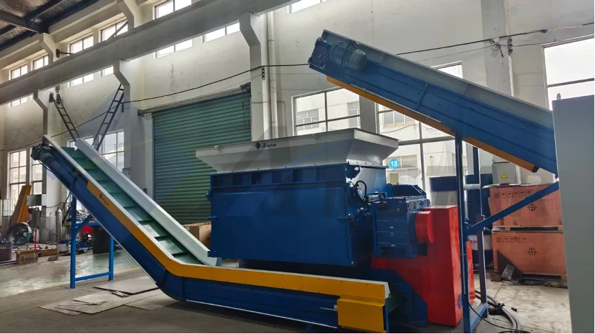 Rubber tire shredder processing whole tires